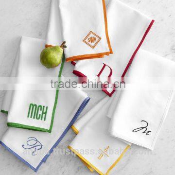 Plain white cotton monogrammed napkin with multiple designs