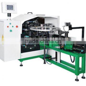 Nipple feeding, spoke lacing and tightening machine