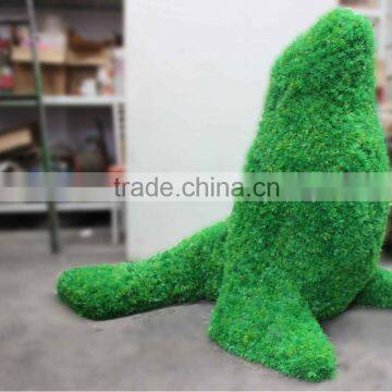 Artificial sea lion made by fake green grass plant for public place decoration