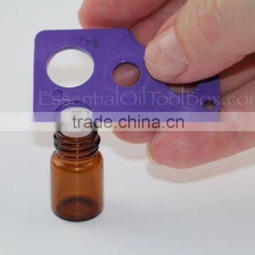 Essential oil bottle swiss key opener