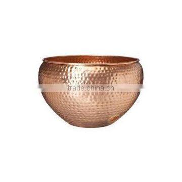 Hammered decorative copper pot for keeping garden Hose