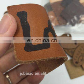 customized bulk debossed logo genuine leather labels for bags