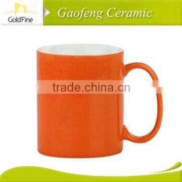 brightly colored ceramic mugs