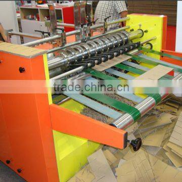 Automatic partition slotter machine for making corrugated cardboard