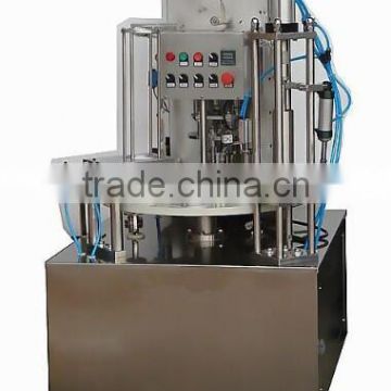 Portion cup filling and sealing machine