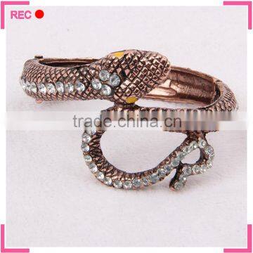 New design imitation gold bangles with crystal decoration, sna0ke shaped ladies fancy bangles