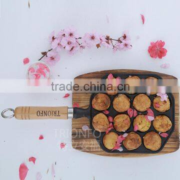 Mini takoyaki cast iron frying pan with wooden handle