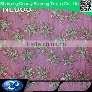 Fushia african elegant leaves embroidered tulle lace fabric for wedding dress                        
                                                                                Supplier's Choice