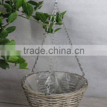 round wicker hanging basket with iron chain used for plants
