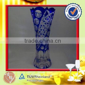 Elegant giant glass vase with artificial carving