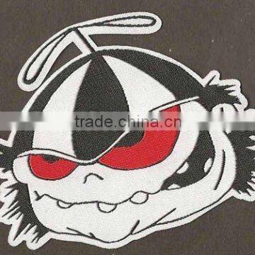 woven patch/badge with merrowed broder and sew on backing