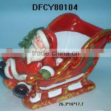 Santa Claus sled candle holder