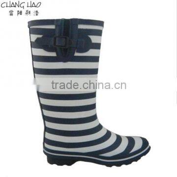 Women fashion rubber rain boot has navy bule and white stripes printed with red buckle and sole