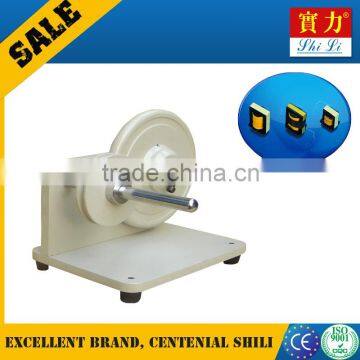 Tape varied transducer relay coiling and wrapping machine