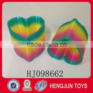 the shape of peach plastic mini rainbow spring toys