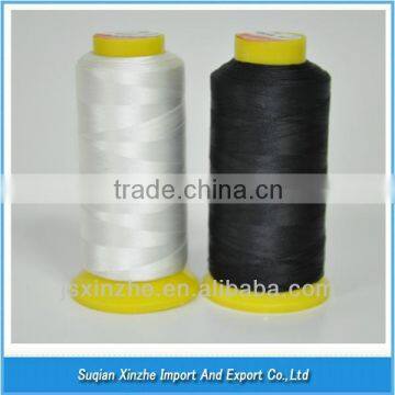 High strength spun polyester sewing thread