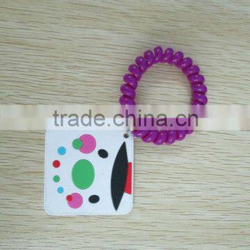 Promotion plastic spring bracelet with embossed pvc charm hanged