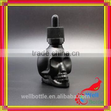 Custom glass bottle for black essential oil bottle with skull shape glass dropper bottle for e-juice