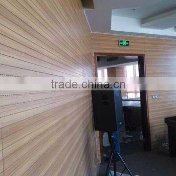 Grooved wood acoustic panel for auditorium