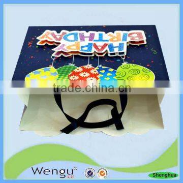 Best selling new design birthday glitter craft stock paper bagg with ribbon bow tie supplier and manufacture