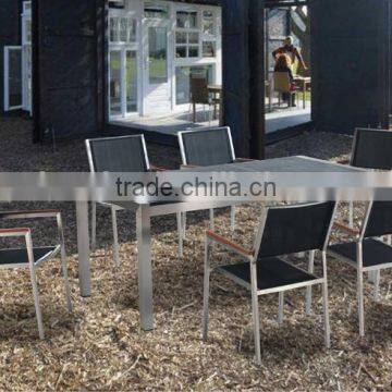 Modern outdoor garden furniture stainless steel dining set, granite table and mesh fabric chair with polywood armrest