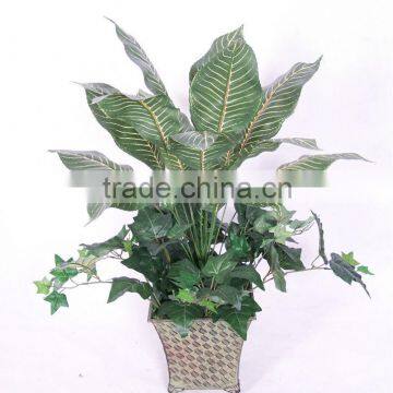 Artificial green bush plants arrangement in pot