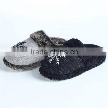 Woman knitted indoor slipper with hand enbroidery snowflake