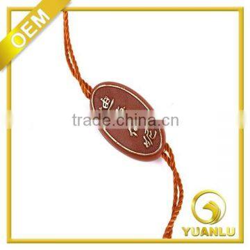 custom logo embossed oval plastic hang tag