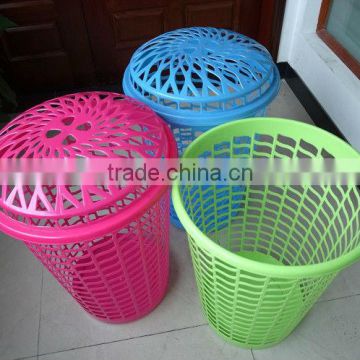 Plastic laundry basket with lid