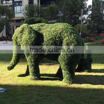 Fiberglass elephant sculpture with artificial grass