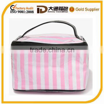 Coated cosmetic bag featuring a striped pattern contrast trim short top handle