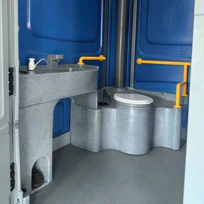 Accessible mobile toilet with handrails