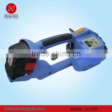 Battery powered automatic high tension plastic strapping tool