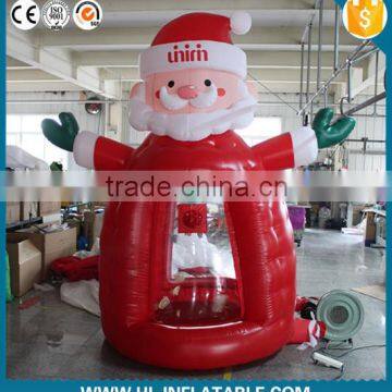 Hot sale!!Christmas promotional inflatable Christmas santa claus money booth for advertisment