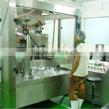 Automatic bottle filling and aluminum foil sealing machine