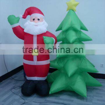 Inflatable santa with tree