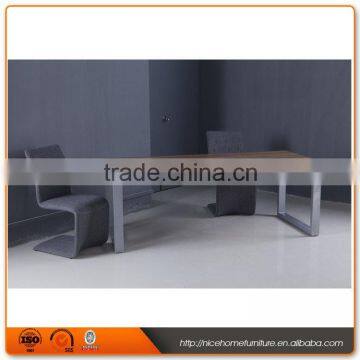 Long narrow stainless steel feet with wooden dining table