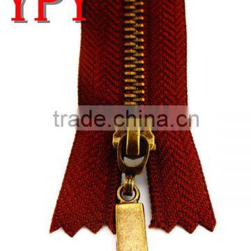 metal zipper for handbags with gold teeth