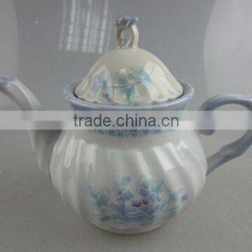 Stock white porcelain teapot with blue decal design