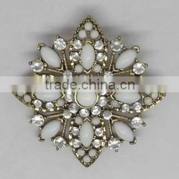 rhinestone encrusted flower brooch