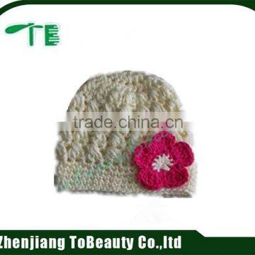 white handmade hat with red flower