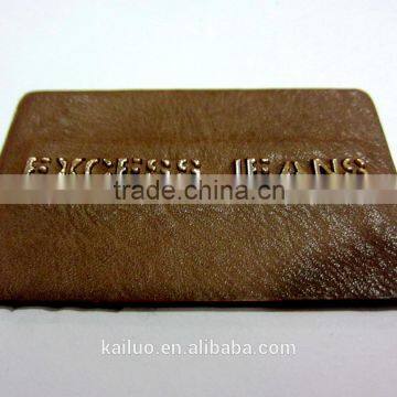 camel color jeans leather label/metal plate in the middle