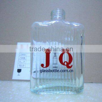 transparent glass spirit bottle