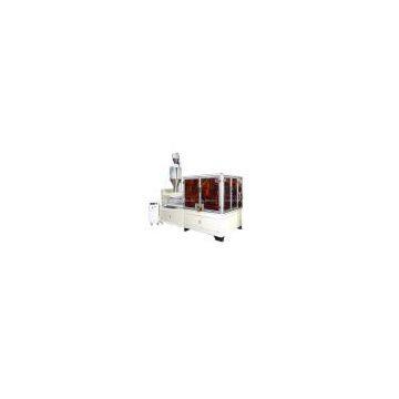Cap lining machine