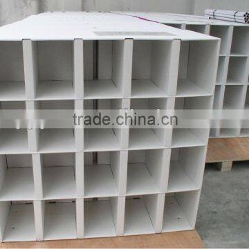 white cardboard display stand shoe rack