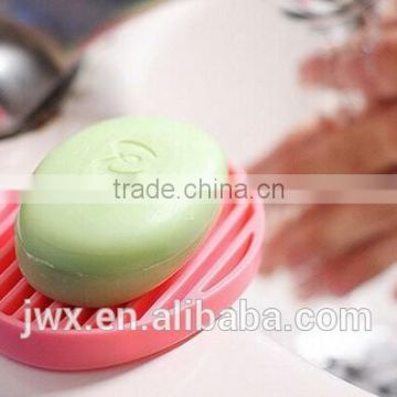 Pink silicone soap frame elliptic by the washbasin