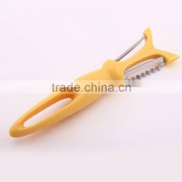 double blade plastic serrated orange vegetable peeler