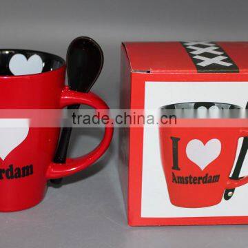 Black and red mug with spoon in color box