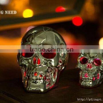 Silver plastic halloween skull head with LED light