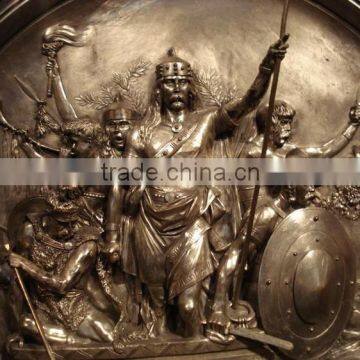 Bronze wall relief sculpture with soldier statues